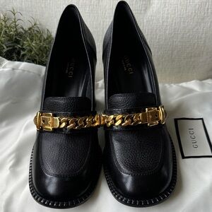 Gucci Women's Black Loafers with Gold Chain Accent